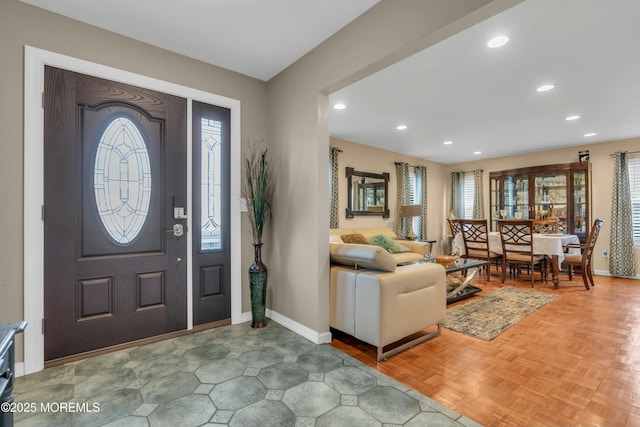 foyer featuring baseboards and recessed lighting