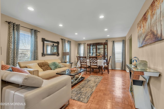 living area with recessed lighting and baseboards