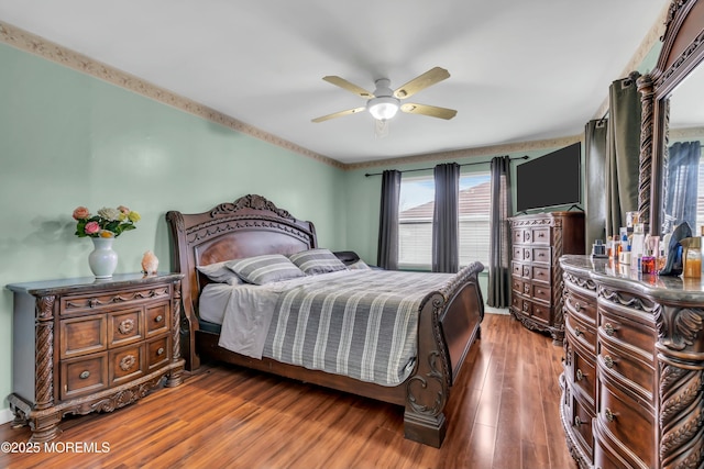 bedroom featuring a ceiling fan and wood finished floors