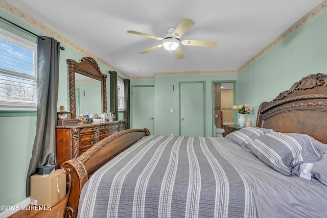 bedroom featuring ensuite bathroom and a ceiling fan