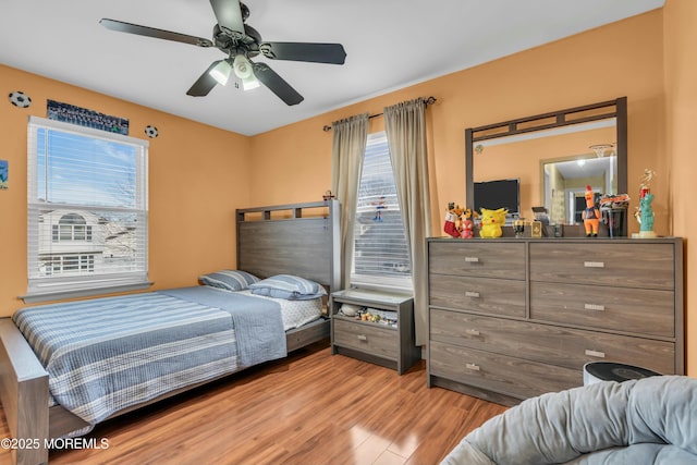 bedroom featuring ceiling fan and wood finished floors