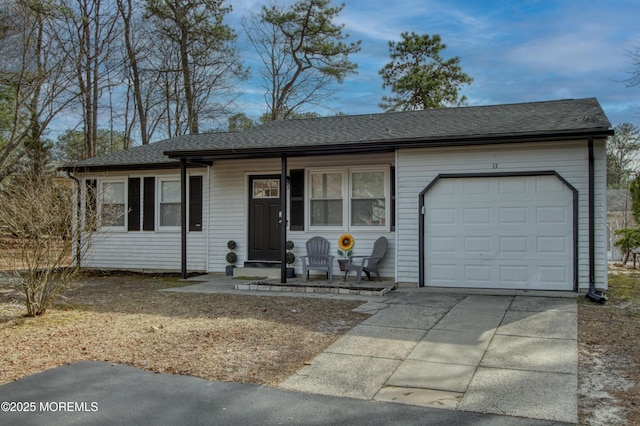 single story home with a garage, covered porch, a shingled roof, and concrete driveway