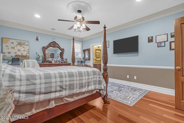 bedroom with crown molding, wood finished floors, baseboards, and ceiling fan