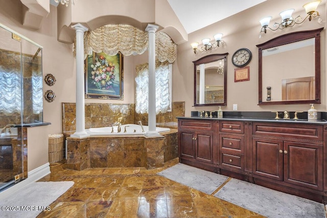 bathroom with a shower with door, a sink, double vanity, a bath, and ornate columns