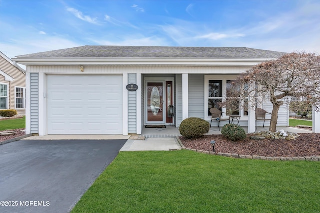 single story home featuring aphalt driveway, roof with shingles, covered porch, an attached garage, and a front lawn