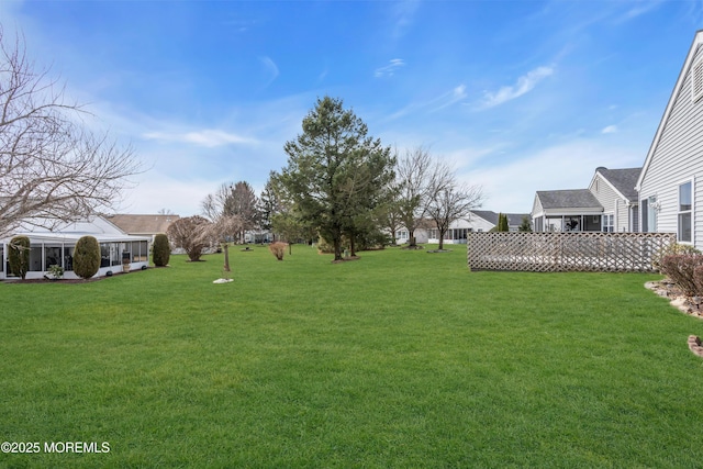 view of yard featuring a sunroom