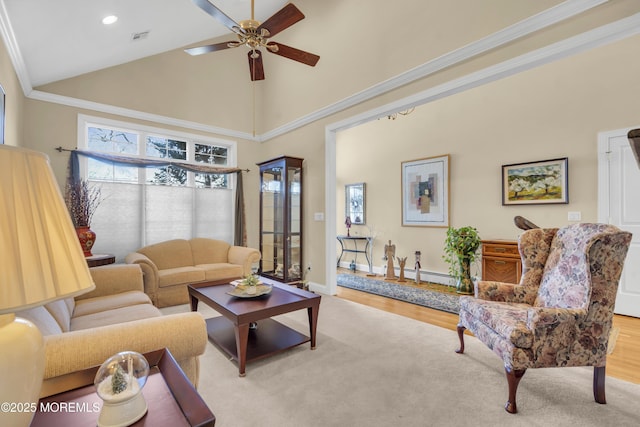 living room featuring visible vents, ceiling fan, wood finished floors, crown molding, and high vaulted ceiling