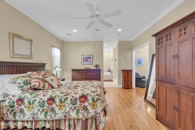 bedroom featuring light wood finished floors, ornamental molding, baseboards, and recessed lighting