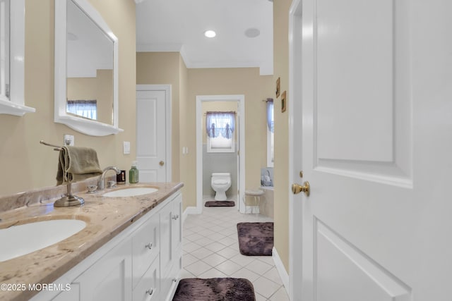 full bath with toilet, a sink, baseboards, tile patterned floors, and double vanity