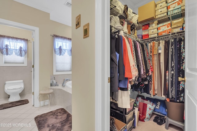 spacious closet featuring visible vents and tile patterned floors