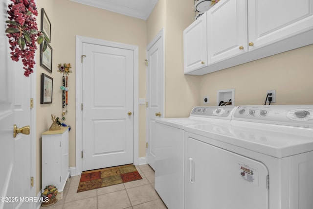 washroom with cabinet space, baseboards, light tile patterned flooring, and independent washer and dryer