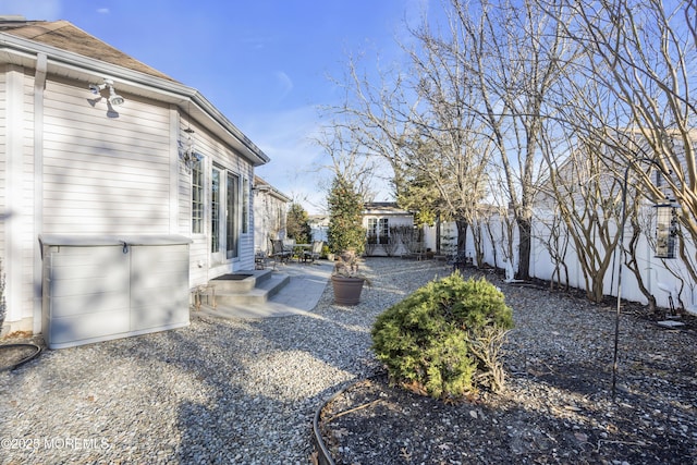 view of yard featuring a patio and fence