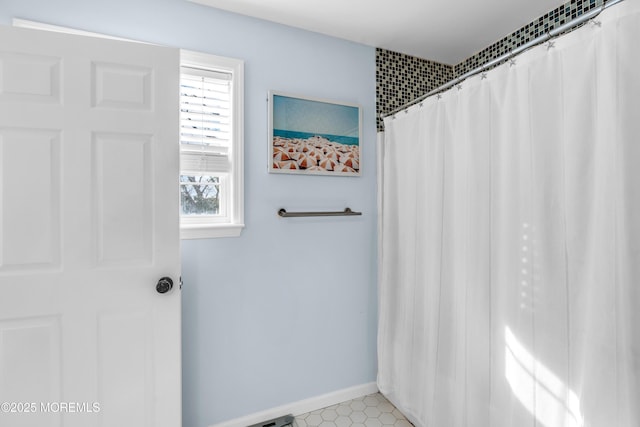 full bathroom with baseboards