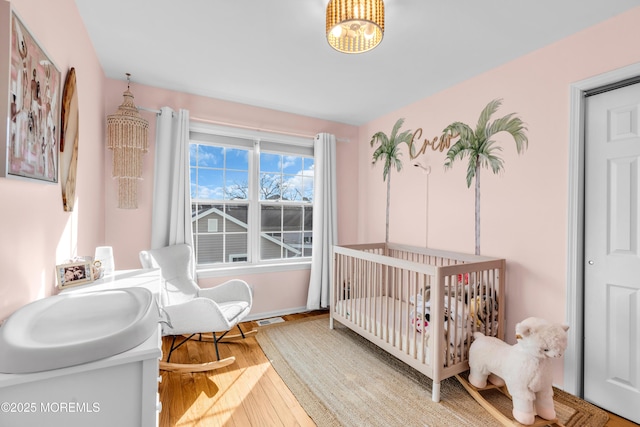 bedroom with wood finished floors