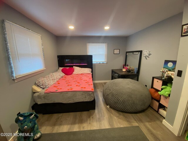 bedroom featuring recessed lighting, baseboards, and wood finished floors