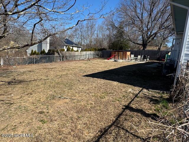 view of yard featuring a fenced backyard