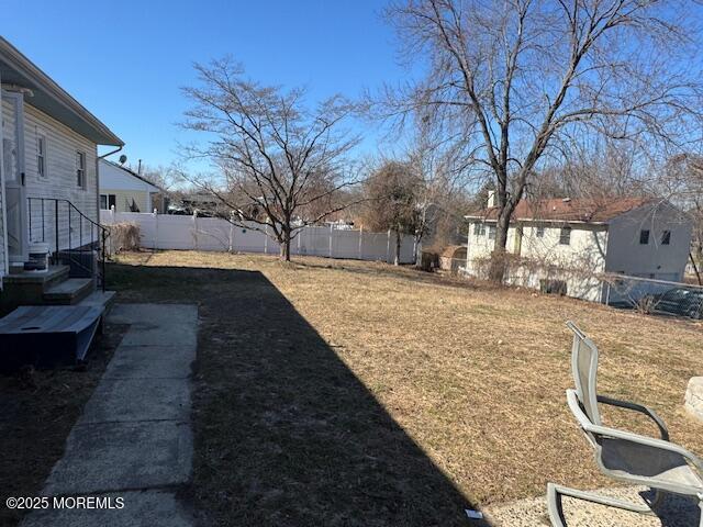 view of yard with fence