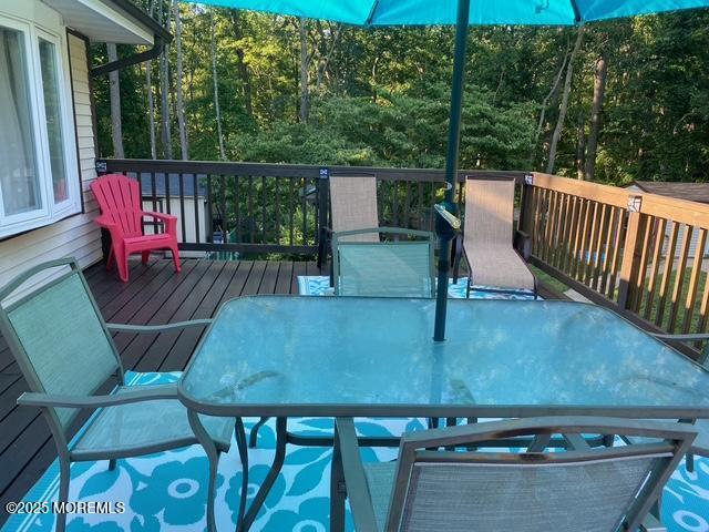 wooden deck with outdoor dining area