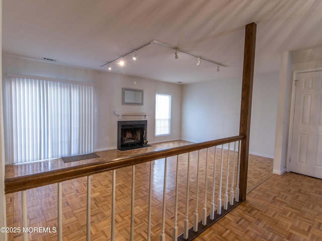 corridor with visible vents and baseboards