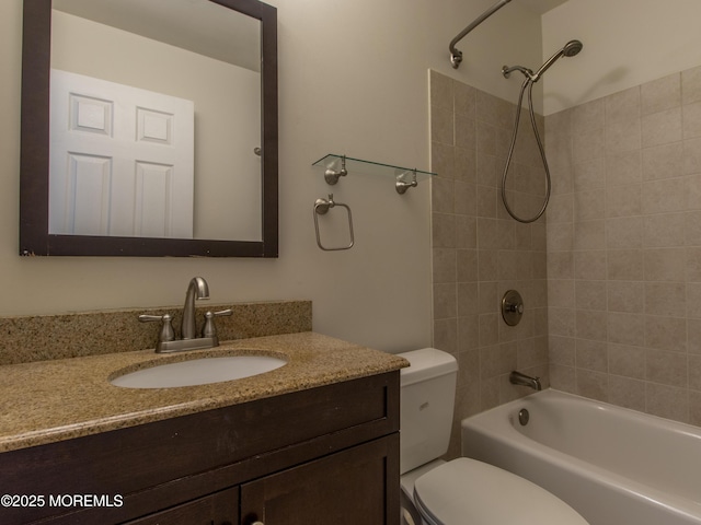 full bathroom featuring toilet,  shower combination, and vanity