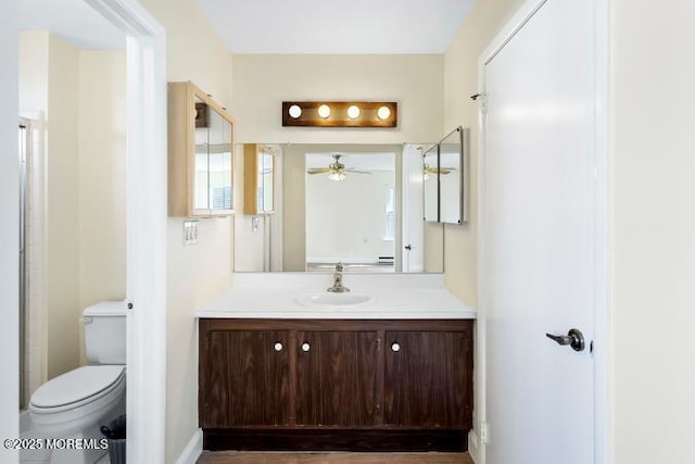 bathroom featuring toilet and vanity