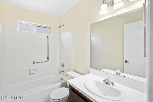 bathroom featuring toilet, shower / tub combination, and vanity