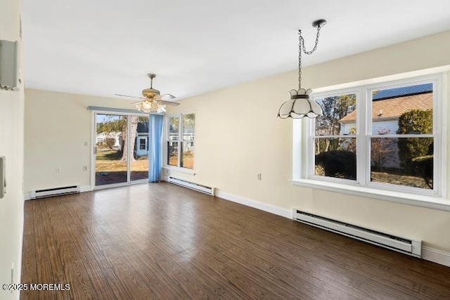 interior space featuring dark wood-style flooring, a baseboard radiator, and baseboards