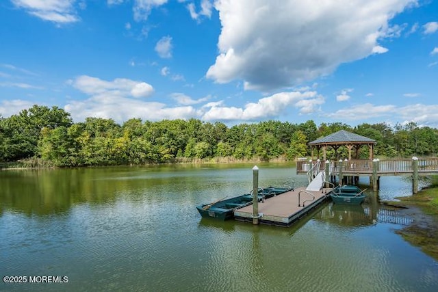 dock area with a gazebo and a water view