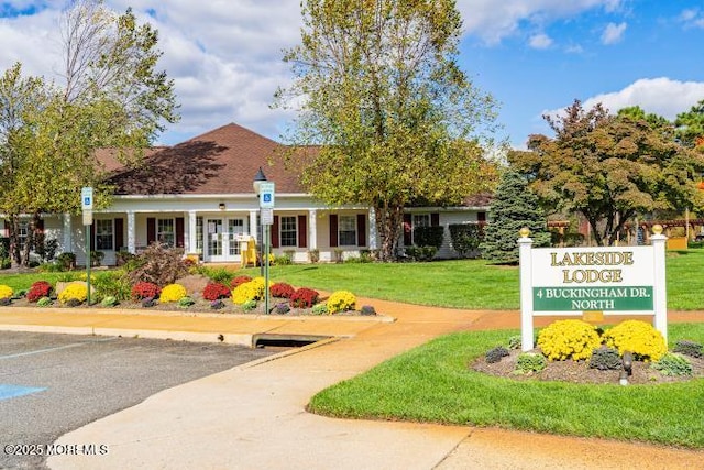 view of property's community with a yard