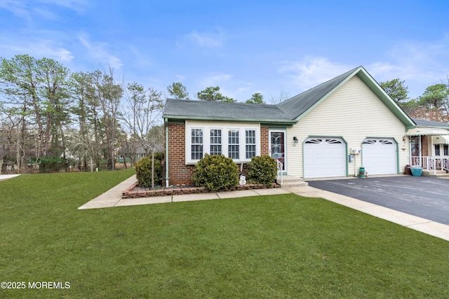 ranch-style house featuring driveway, brick siding, a front lawn, and an attached garage