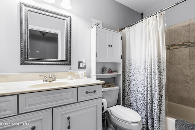 bathroom with shower / bath combination with curtain, vanity, and toilet