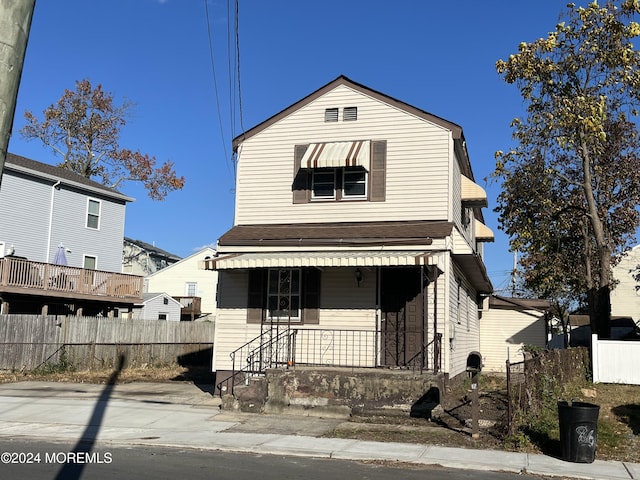 view of front of house featuring fence