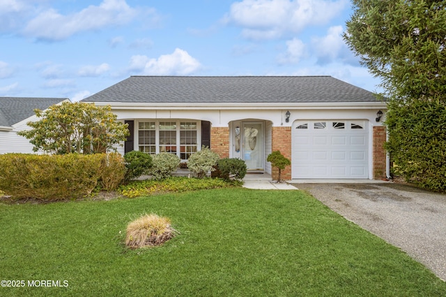 ranch-style house featuring brick siding, a front lawn, aphalt driveway, roof with shingles, and an attached garage