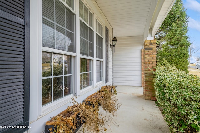 view of exterior entry with a porch