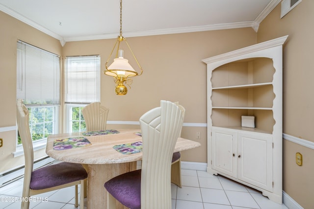 dining area with light tile patterned floors, baseboards, visible vents, and ornamental molding