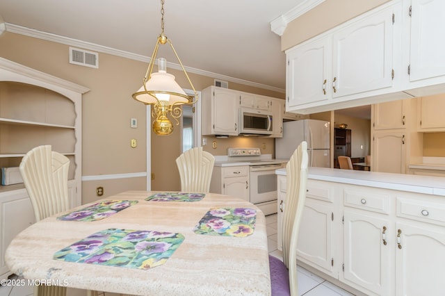 dining space featuring light tile patterned flooring, visible vents, and crown molding