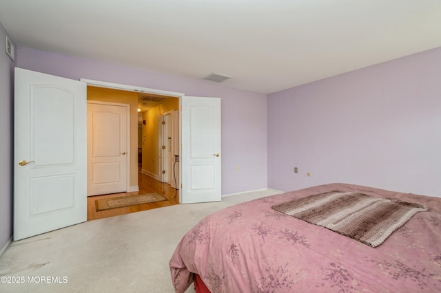 carpeted bedroom with visible vents