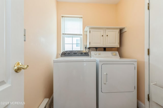 laundry area featuring cabinet space and washing machine and clothes dryer