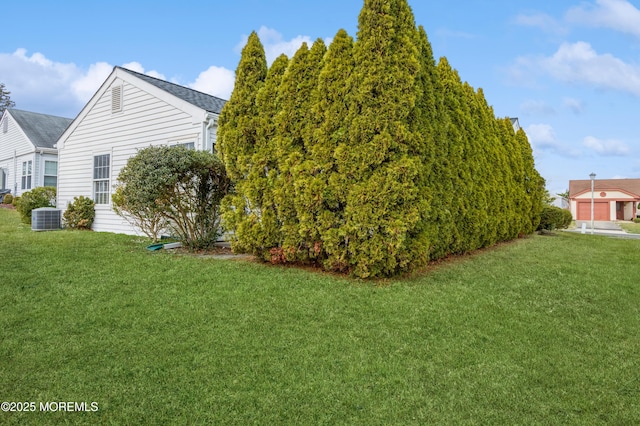 view of yard with central AC