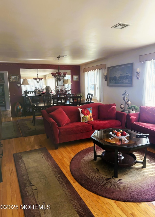 living room featuring hardwood / wood-style floors and visible vents