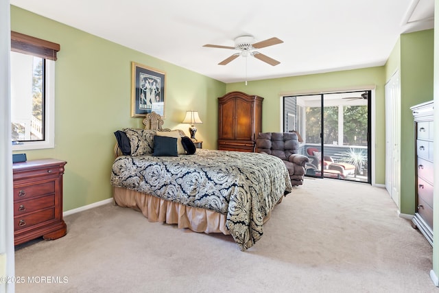 carpeted bedroom featuring access to exterior, baseboards, and a ceiling fan