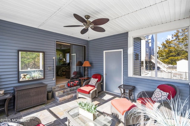 view of patio featuring ceiling fan