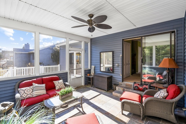 sunroom / solarium with ceiling fan