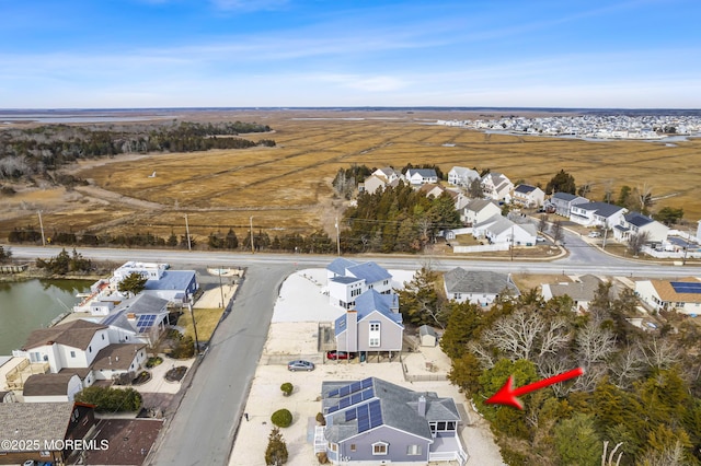 birds eye view of property with a residential view