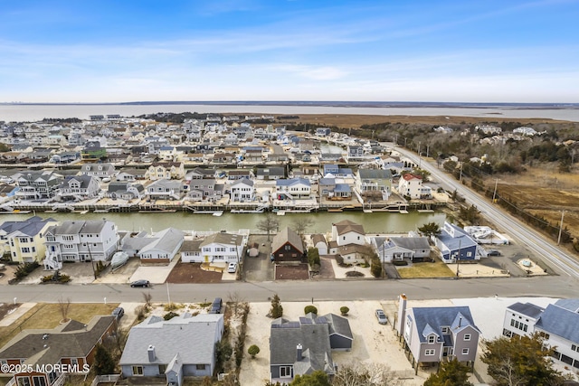 bird's eye view featuring a residential view and a water view