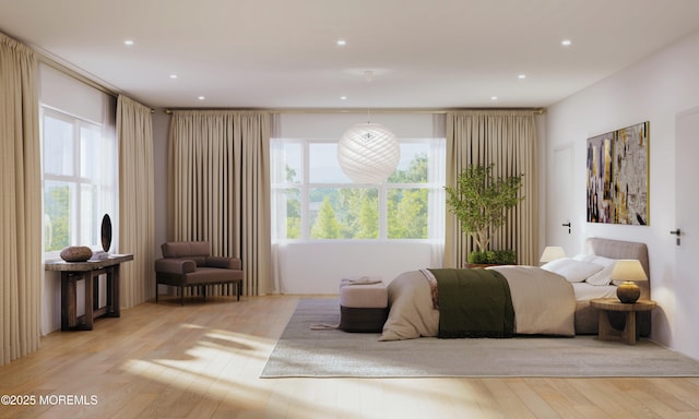 bedroom featuring wood finished floors and recessed lighting