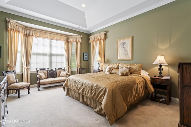 bedroom featuring a tray ceiling, light carpet, and baseboards