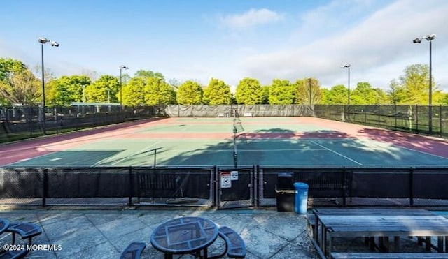 view of sport court with community basketball court and fence