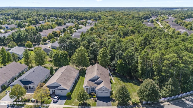 bird's eye view featuring a residential view and a forest view