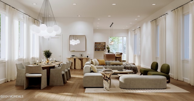 living room with light wood finished floors and recessed lighting